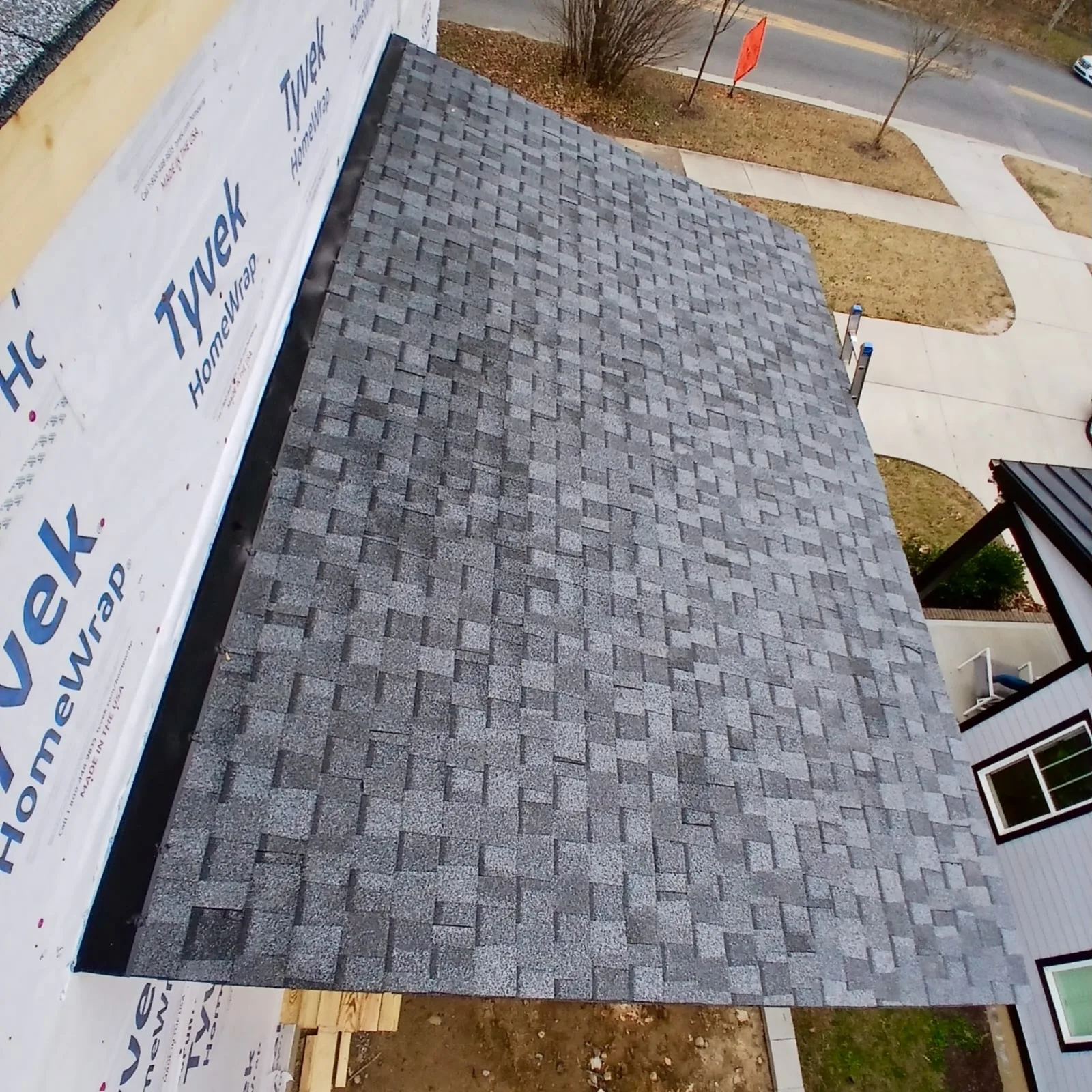 Shingle roof on a new construction home with Tyvek wrap