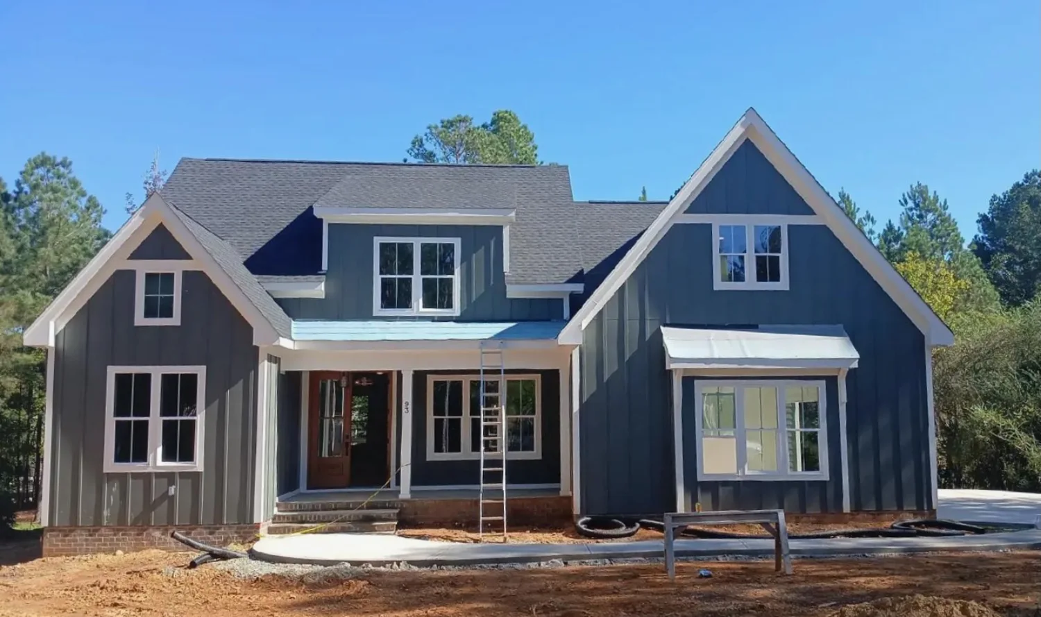 New board and batten siding installation on a residential home in North Carolina